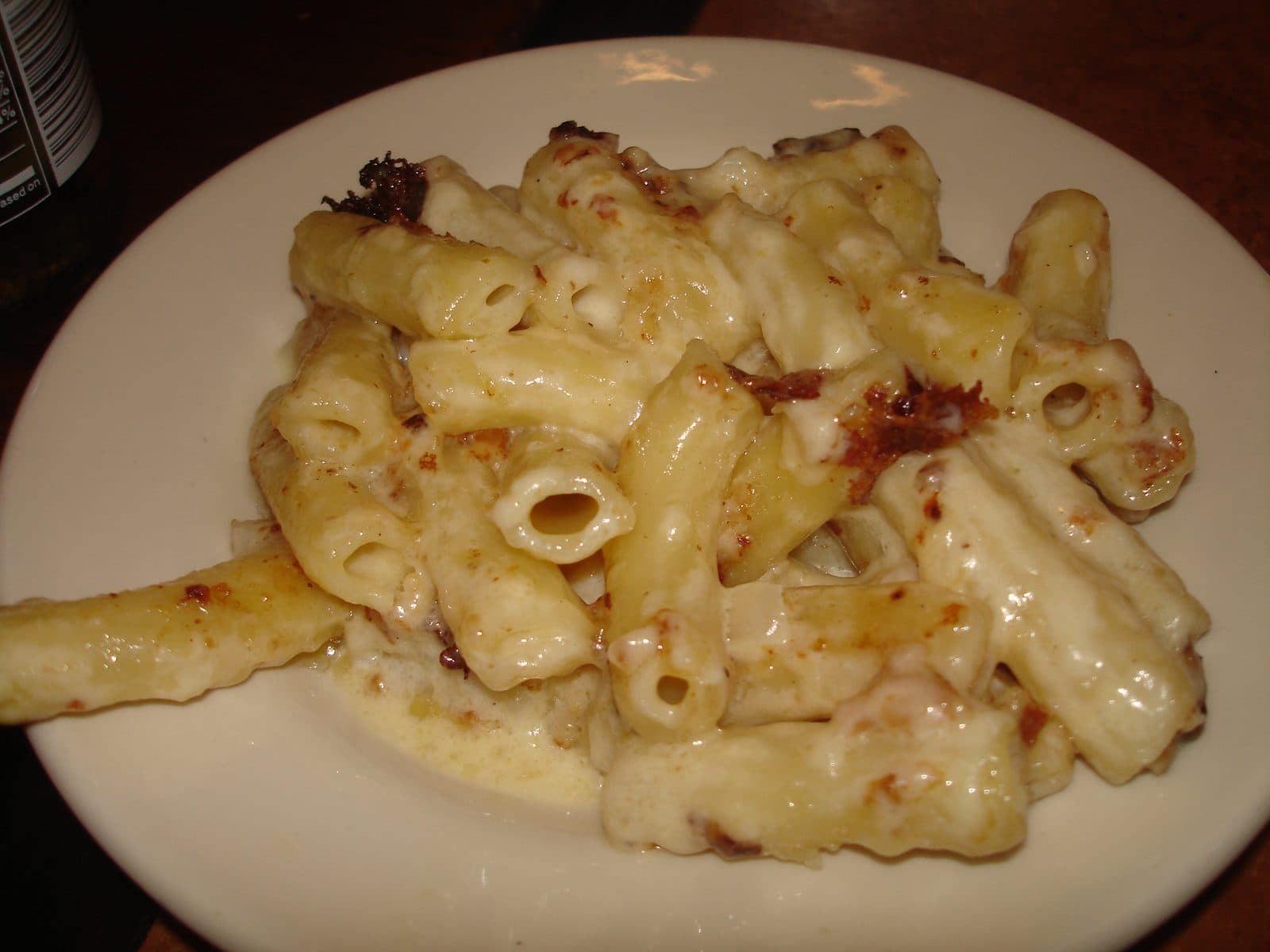 Plate of creamy macaroni and cheese with golden baked edges