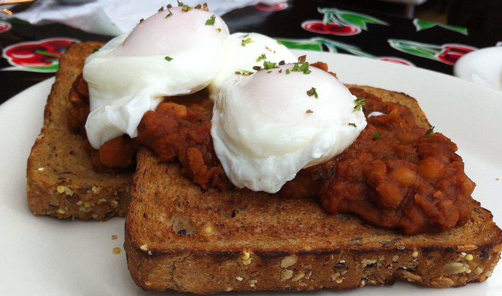 Two poached eggs on baked beans on wholemeal toast